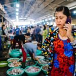 How India beat China to become the biggest smartphone maker for the US - Boss lady at a seafood market outside of Saigon