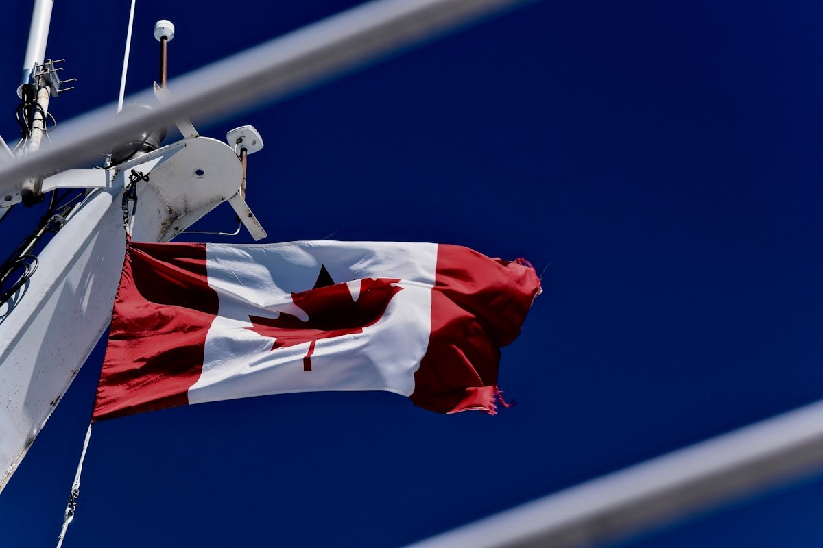 Canada will match U.S. tariff exemptions under the USMCA trade pact, according to Prime Minister Carney. - Canadian Flag