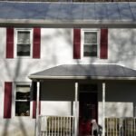 FBI raids former national security advisor John Boltonâ€™s Maryland home - Old 2 story brick house with red trim