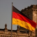 German Minister says China 'increasingly aggressive. - The German flag at the Reichstag building.