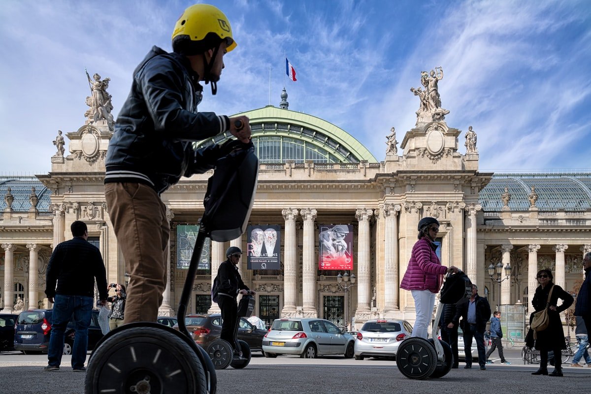 Germany to host the ITS World Congress 2025, showcasing smart mobility solutions. - Tourist on a city tour of Paris by Segway passing in front of the Grand-Palais