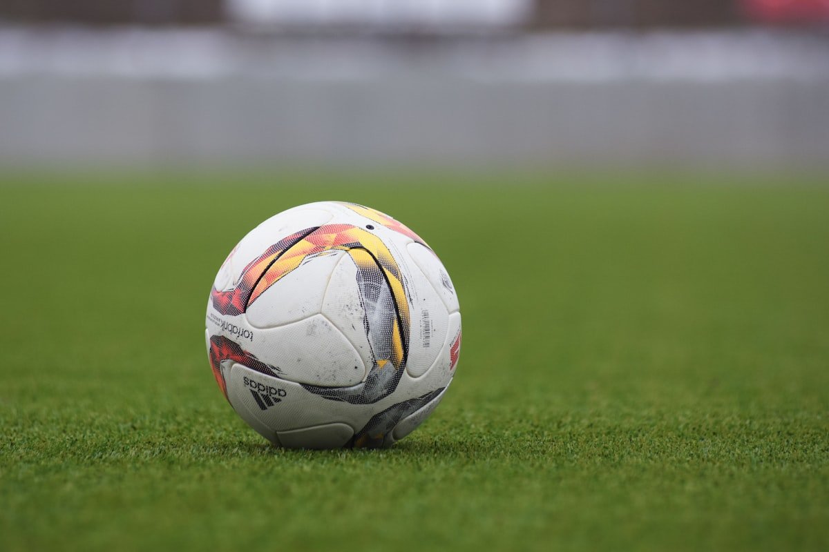 Man arrested after footballer 'racially abused' during first Premier League match of season - Adidas soccer ball on a grass pitch