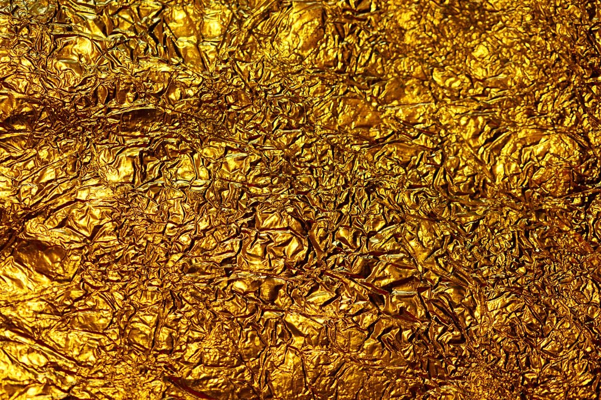 Three men convicted for stealing ancient gold coins in a 9-minute museum heist - Gold foil background