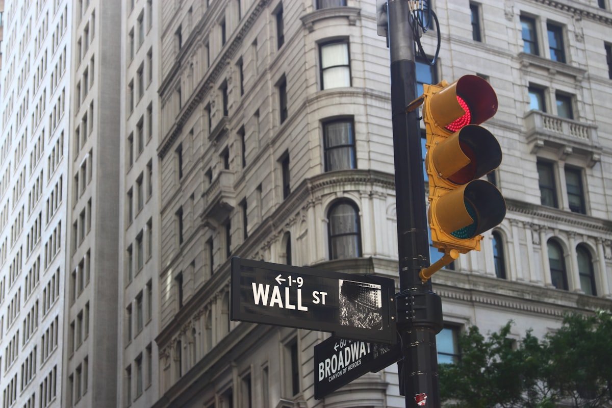 Wall Street suffers biggest drop since May after hiring slowdown and new tariffs - Wall St and Broadway signs